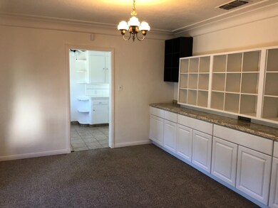 Formal Dining Room with original brass fixture