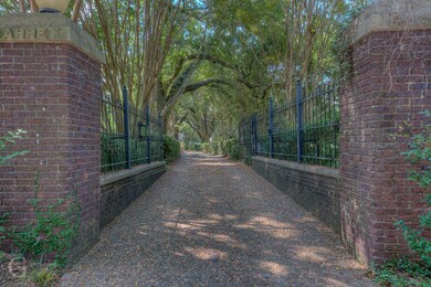 Entrance to property through canopied driveway wit