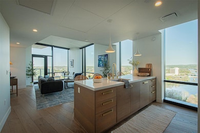 Kitchen featuring expansive windows, visible vent