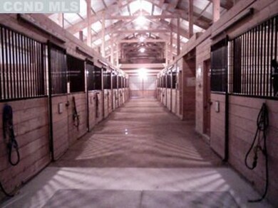 Interior of barn showing stalls