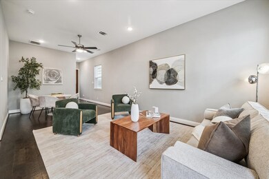 Spacious open-concept living and dining area with abundant natural light