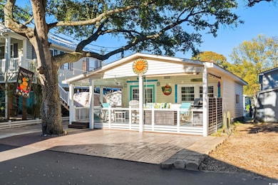 View of front of house with a deck