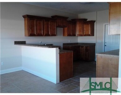 Kitchen. raised bar and ceramic tile flooring
