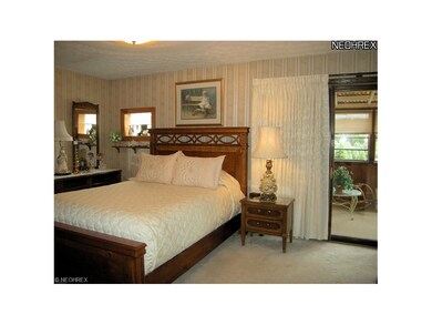 Master bedroom with access to sun room.