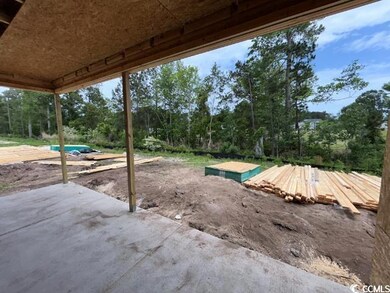 View of patio / terrace with view of wooded area