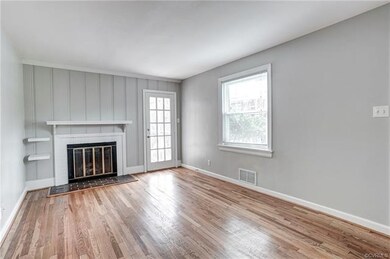 Family Room with Hardwood Floors, Wood Burning Fireplace, Built-ins and Screened Porch