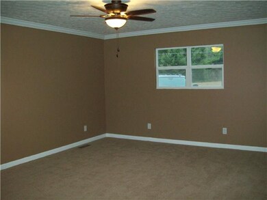 Large Master bedroom with new carpet, paint and tr