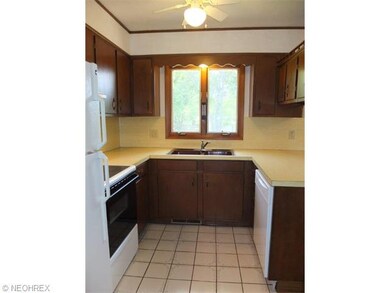 Kitchen has oven, range, refrigerator and dishwash