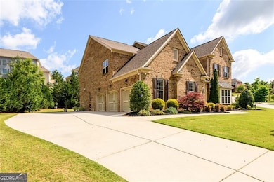 3-Car Garage Side Entry with expansive drive way and parking pad.