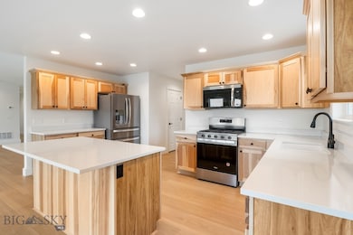 spacious kitchen with quartz tops and pantry