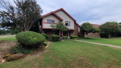 View of property featuring a front yard