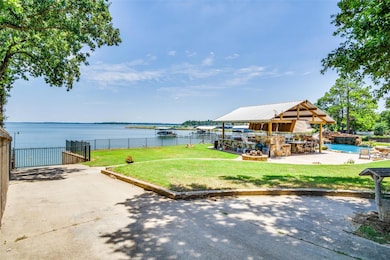 View of yard featuring a patio, a water view, and 