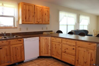 Kitchen has lots of counter space and cabinets wit