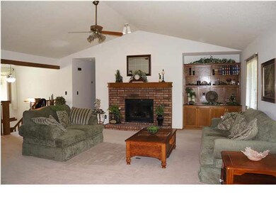Large Living Room Area with A Beautiful Fireplace 
