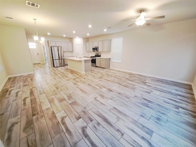 Unfurnished living room featuring recessed lighti