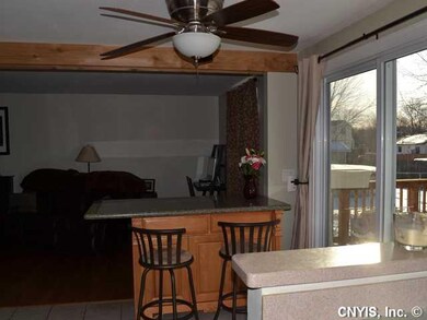 Kitchen with view of the deck as well as the livin