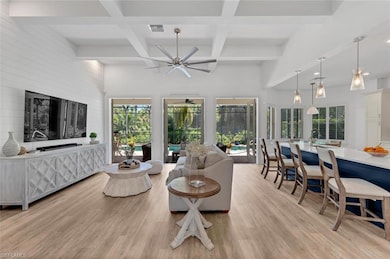 Living room featuring visible vents, coffered ceil