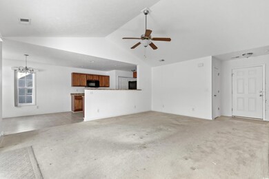 Unfurnished living room with vaulted ceiling, ligh