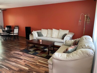 Newer flooring in living room and dining room