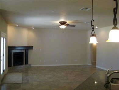 View of den/living room. Corner fireplac