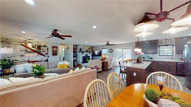 View to kitchen, sitting room & TV room from dinin