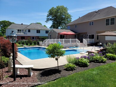 L-Shaped Pool Landscaped Yard