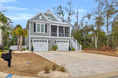 View of front of house with a sunroom and a garage