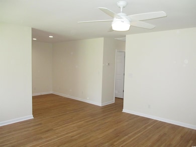 Unfurnished room featuring light wood finished floors, ceiling fan, and recessed lighting
