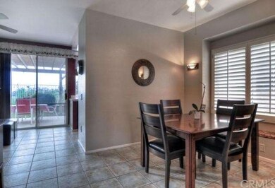 Dining Room is accented with warm designer colors 