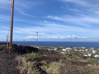 Eastern corner of parcel is about 10 feet past pole.
