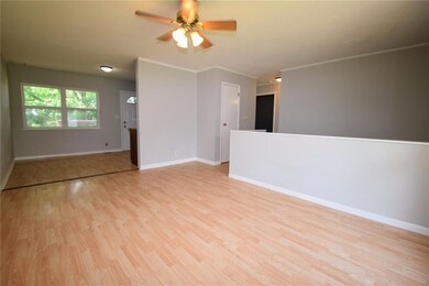 LIVING ROOM OPENS TO THE DINING ROOM
