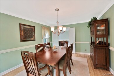 Formal Dining Room with Hardwood Floors, Crown Mol
