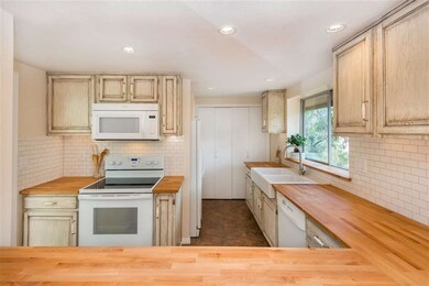 Kitchen has recently remodeled cabinets, new garba