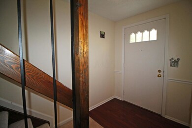 Foyer with hardwood floor