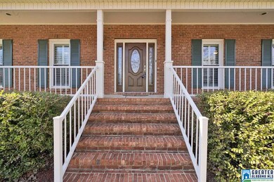 Grand entrance to a massive long front porch.