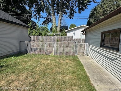 View of yard with a gate