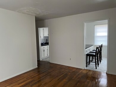 Unfurnished room featuring dark hardwood / wood-st