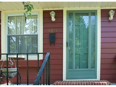 The front entrance has a storm door, wrought iron rails and plenty of room to sit and relax!