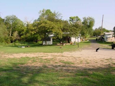 Exterior Front. LOT AND SMALL STORAGE BUILDINGS