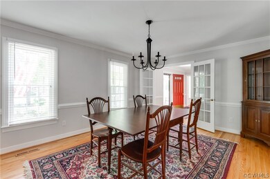 Dining area featuring ornamental molding, an invit