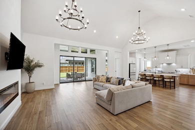 Vaulted ceilings, oversized windows, and warm engi