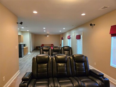 Finished basement with rec space and flex room, ideal for guests, gym, or media
