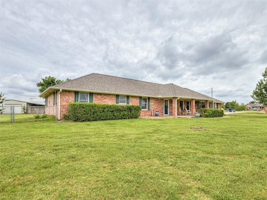 Ranch-style home with brick siding and a shingled roof