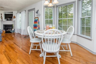 Dining area with an inviting chandelier, light har