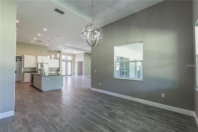 Dining Room view of kitchen and entry way into gre