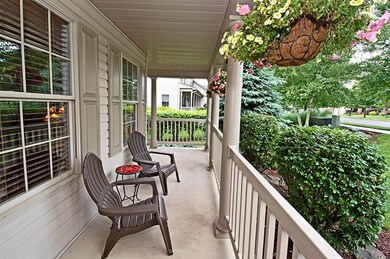 The wrap around porch leads to the side entry of t
