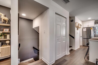 Corridor featuring recessed lighting, wood finishe