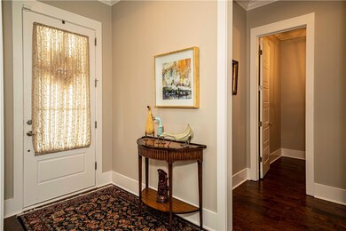 Entryway with warm wood tones and soaring ceilings