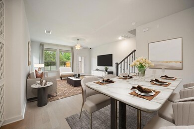 Dining space with light wood finished floors, sta