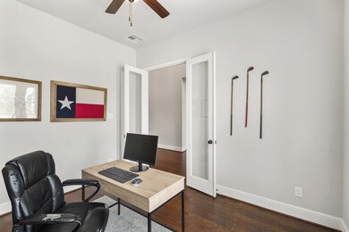 The glass-paned French doors allow for added privacy while still feeling connected to the rest of the home. The space can easily accommodate additional storage in the form of bookcases, a file cabinet, or extra seating.